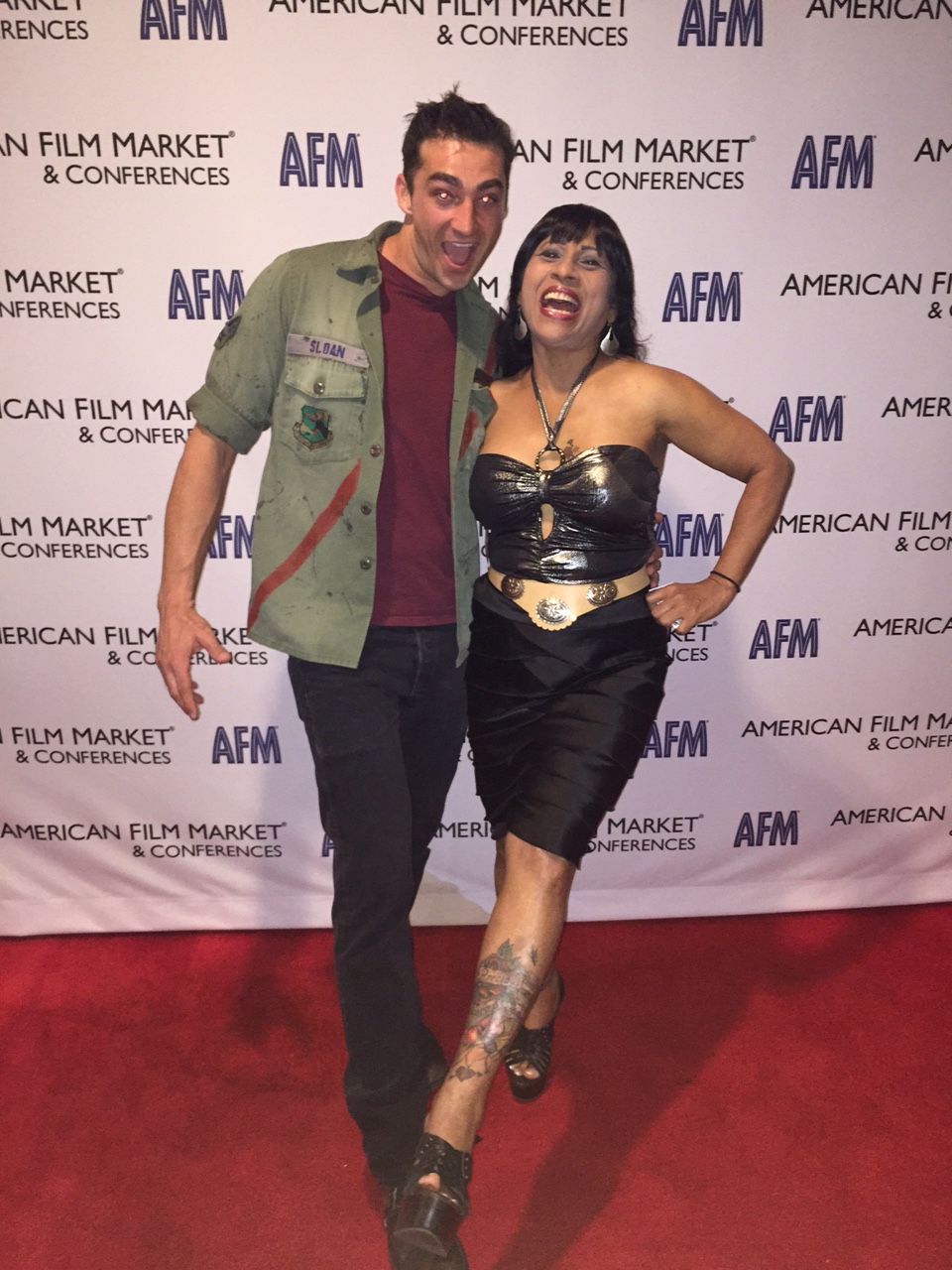 John Kyle Sutton and Precious Hilton at the American Film Market