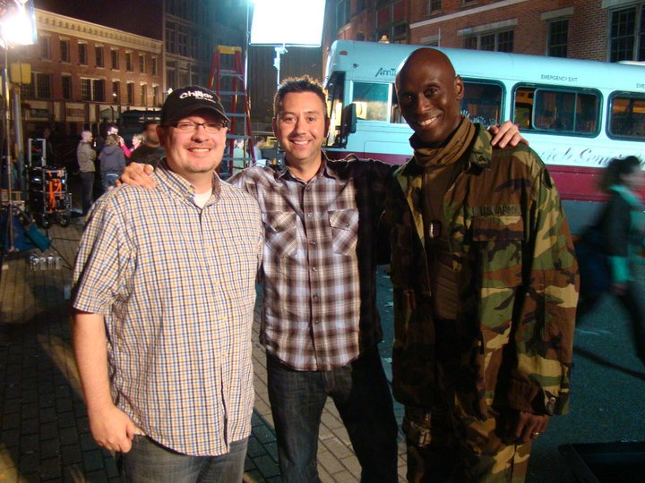 Zach O'Brien, Shane O'Brien, and Lance Reddick on the set of 
