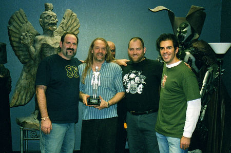 (L-R) Howard Berger, Greg Nicotero, and Bob Kurtzman of K.N.B. Efx, with Eli Roth, and the 2002 Sitges Film Festival trophy for best make-up effects.