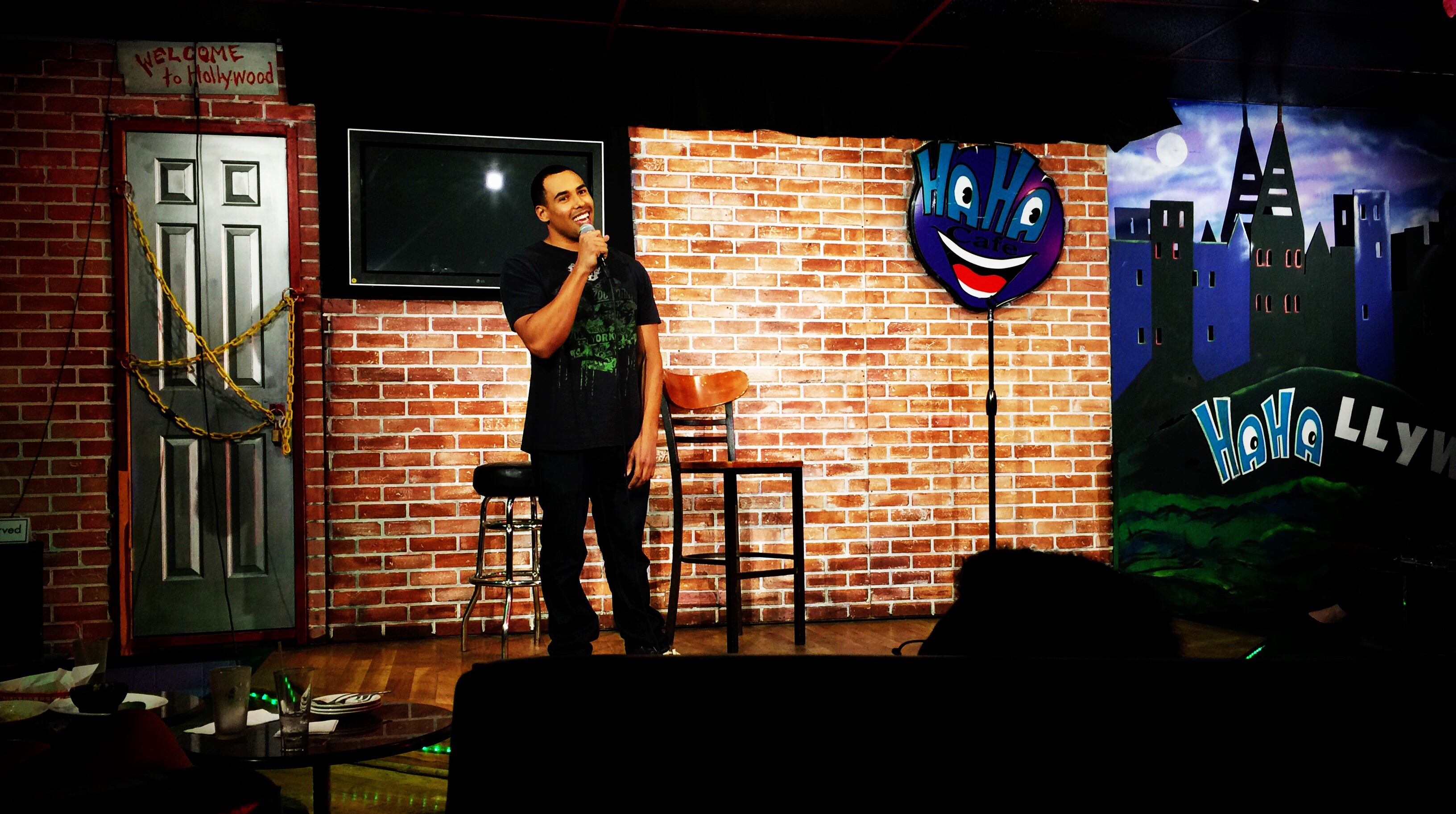 Matthew Jordan performing stand-up at the HaHa Comedy Club