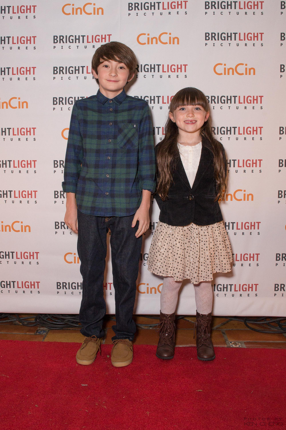 Spencer Drever & Kennedi Clements pose for photographers on the red carpet at Brightlight Pictures' annual Vancouver International Film Festival (2014).