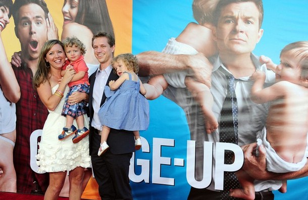 Castmember Luke Bain (2nd L) and his twin sister Lauren (R) are held by their parents Missy and Matthew Bain at the world premiere of 'The Change-Up' at the Village Theatre in Los Angeles, California on August 1, 2011.