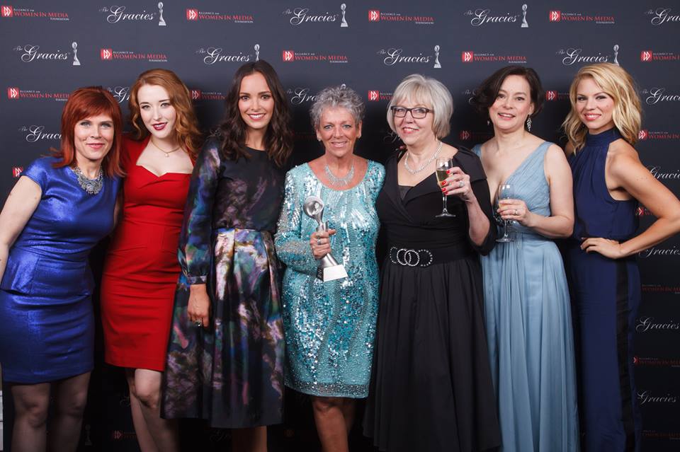 Bomb Girls winner of Outstanding Drama Series at the 2013 Gracie Awards Adrienne Mitchell, Charlotte Hegele, Jodi Balfour, Debra Drennan, Janis Lundman, Meg Tilly & Ali Liebert