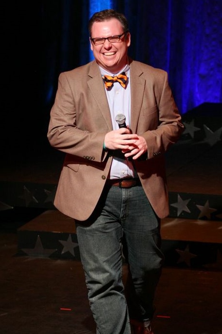 Justin Barnette doing stand-up at the West Side YMCA's 2013 benefit.