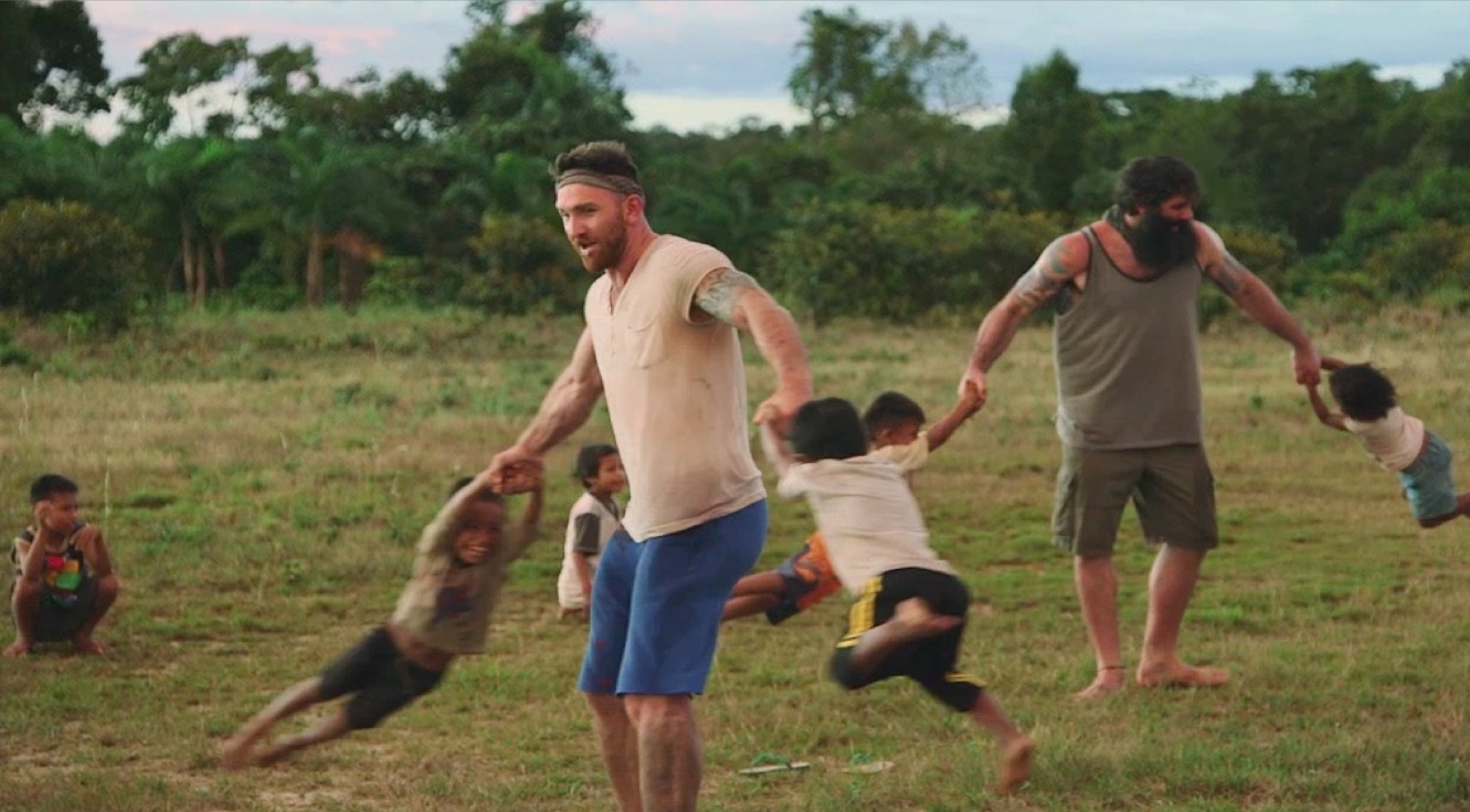 Devan Long playing with the Tatooya children while filming Going Native