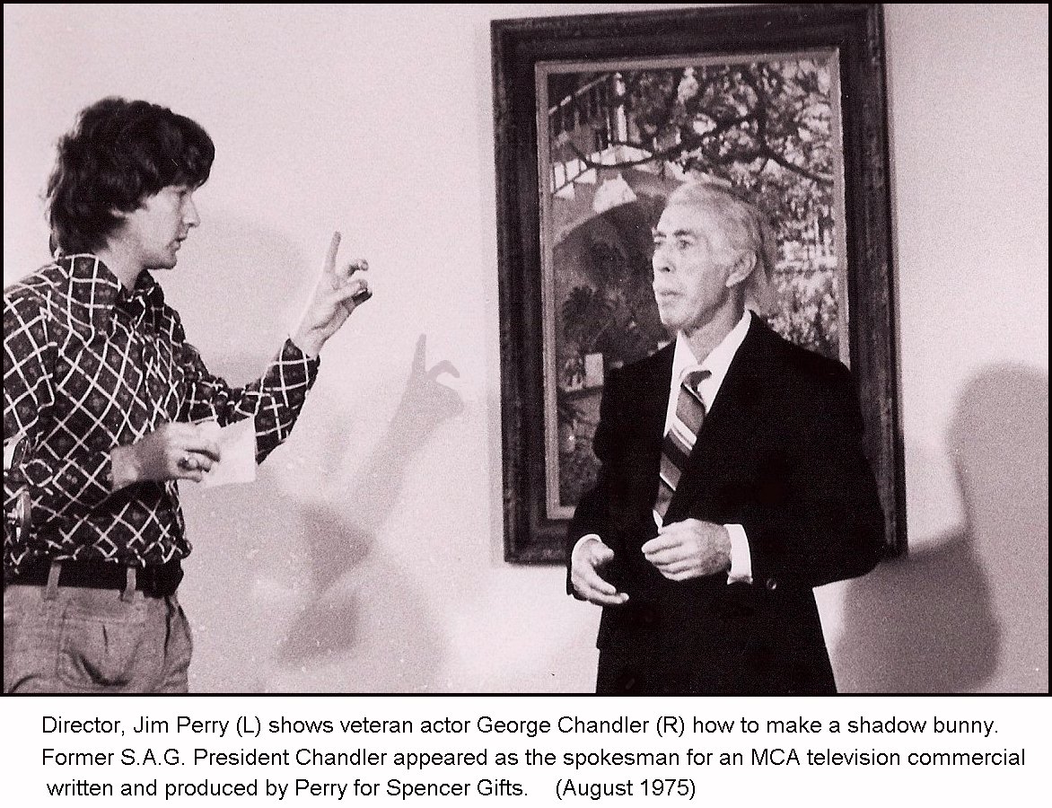 Director James L. Perry teaches veteran character actor George Chandler how to make a shadow bunny on a Universal Studios project.