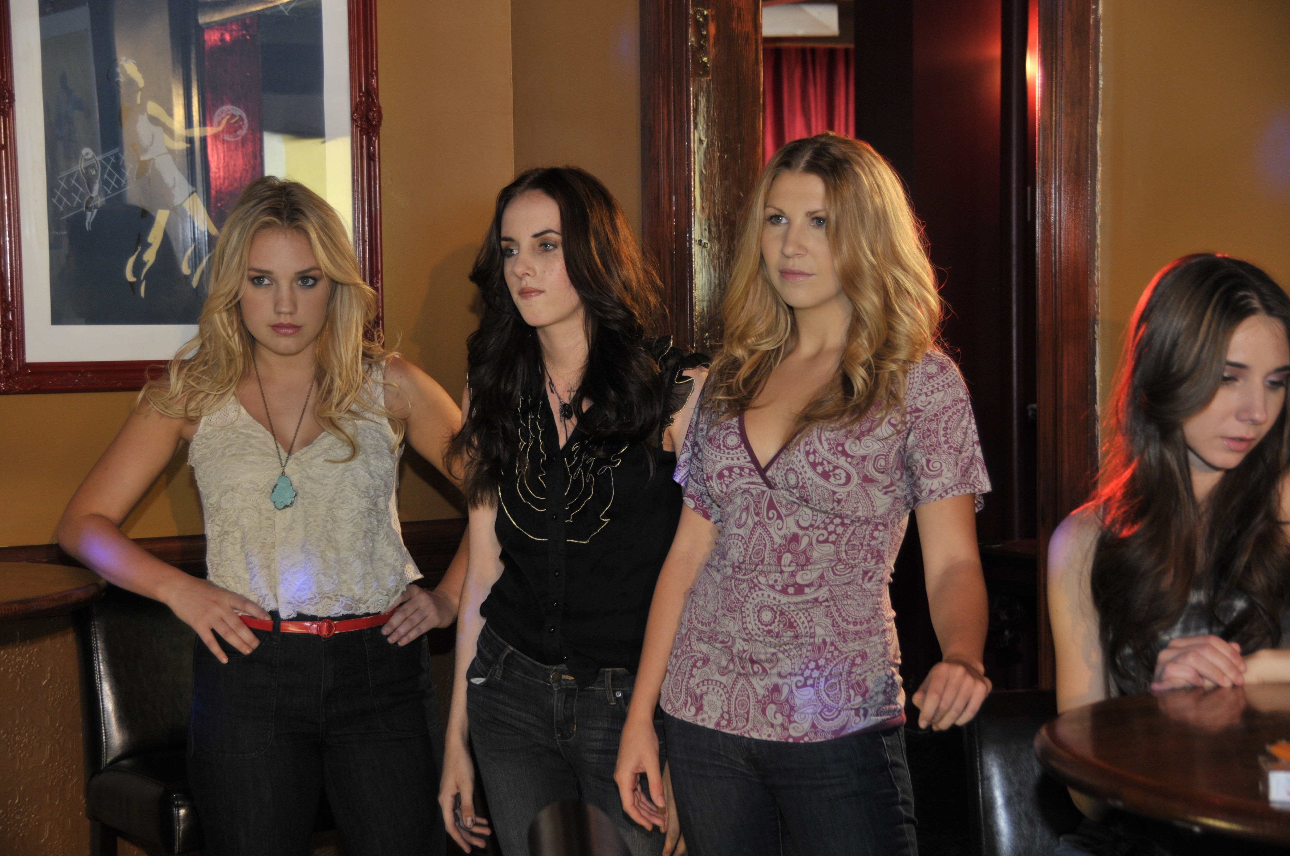 Ashley (Maggie Talbot-Minkon), Sally (Leah Lyons), Stephanie (Courtney Murphy) walk into Kalebs Bar in Fat City.