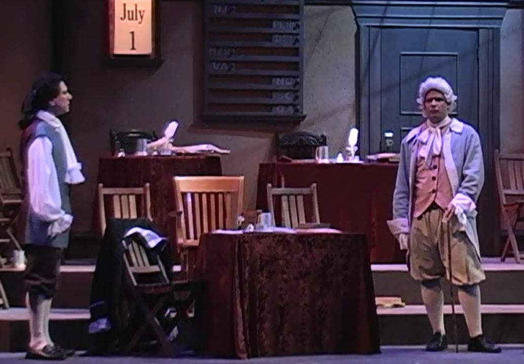 Peter Tedeschi, far left, as John Adams in 1776 in a scene with Dr. Lyman Hall.