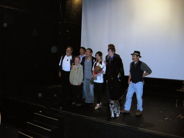 Casr and Director on stage at premier 