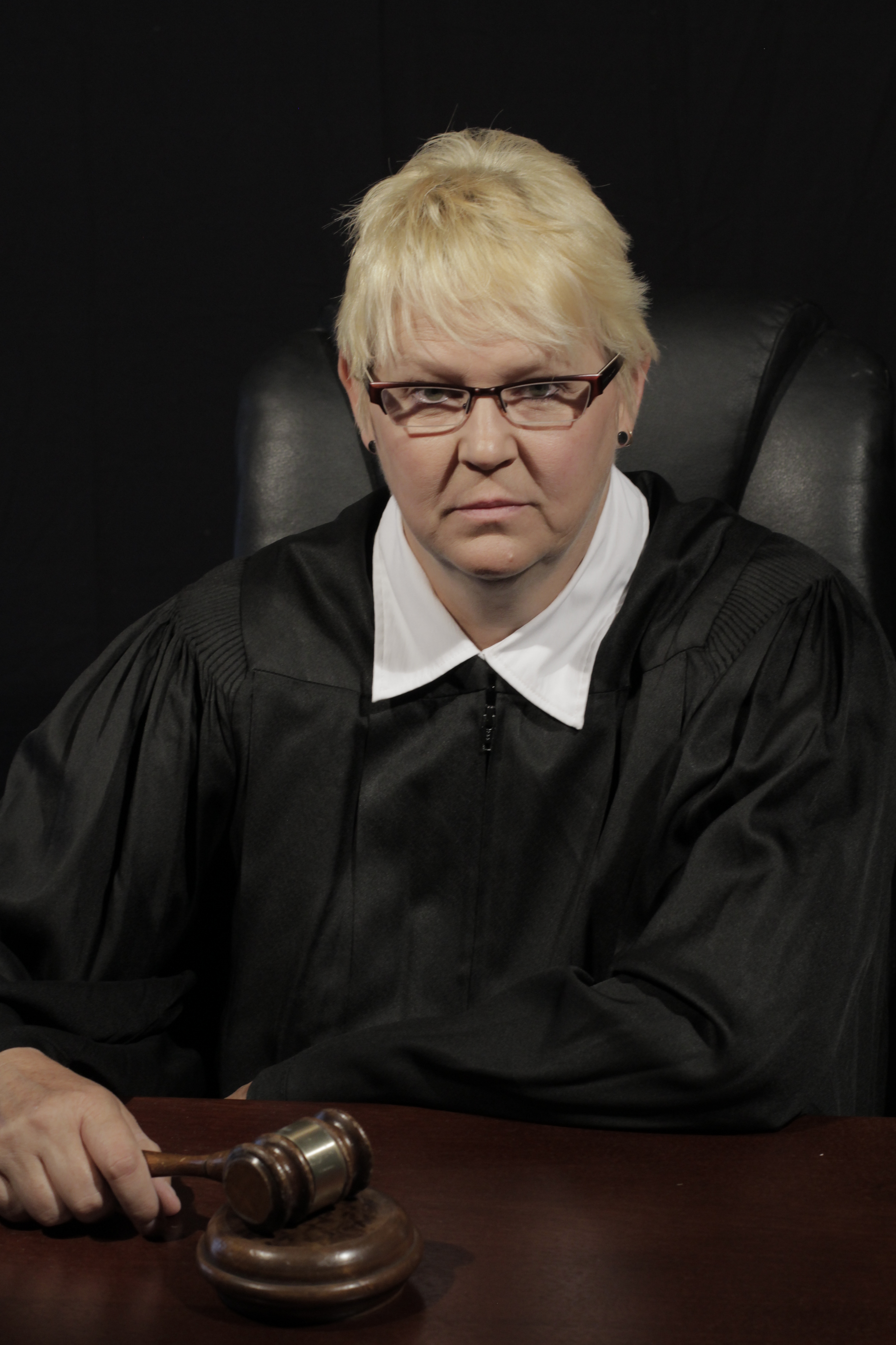 Teresa Parker as the Judge in The Coalition Music Video