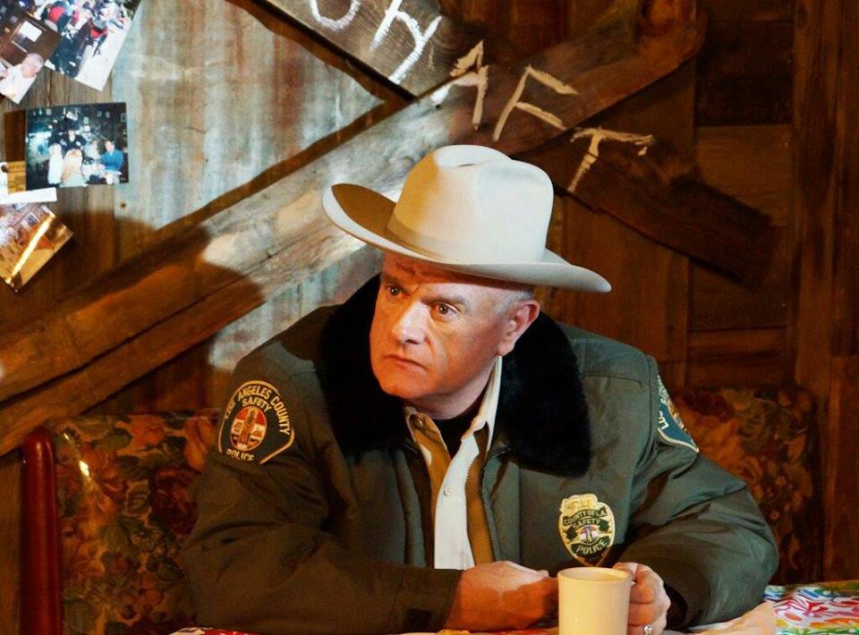 Bobby Reed as the Sheriff in 