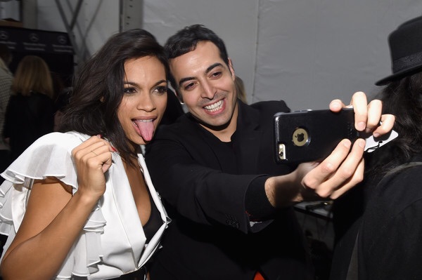 Rosario Dawson and Mohammed Al Turki pose backstage at Naomi Campbell's Fashion For Relief Charity Fashion Show during Mercedes-Benz Fashion Week Fall 2015 at The Theatre at Lincoln Center on February 14, 2015 in New York City.