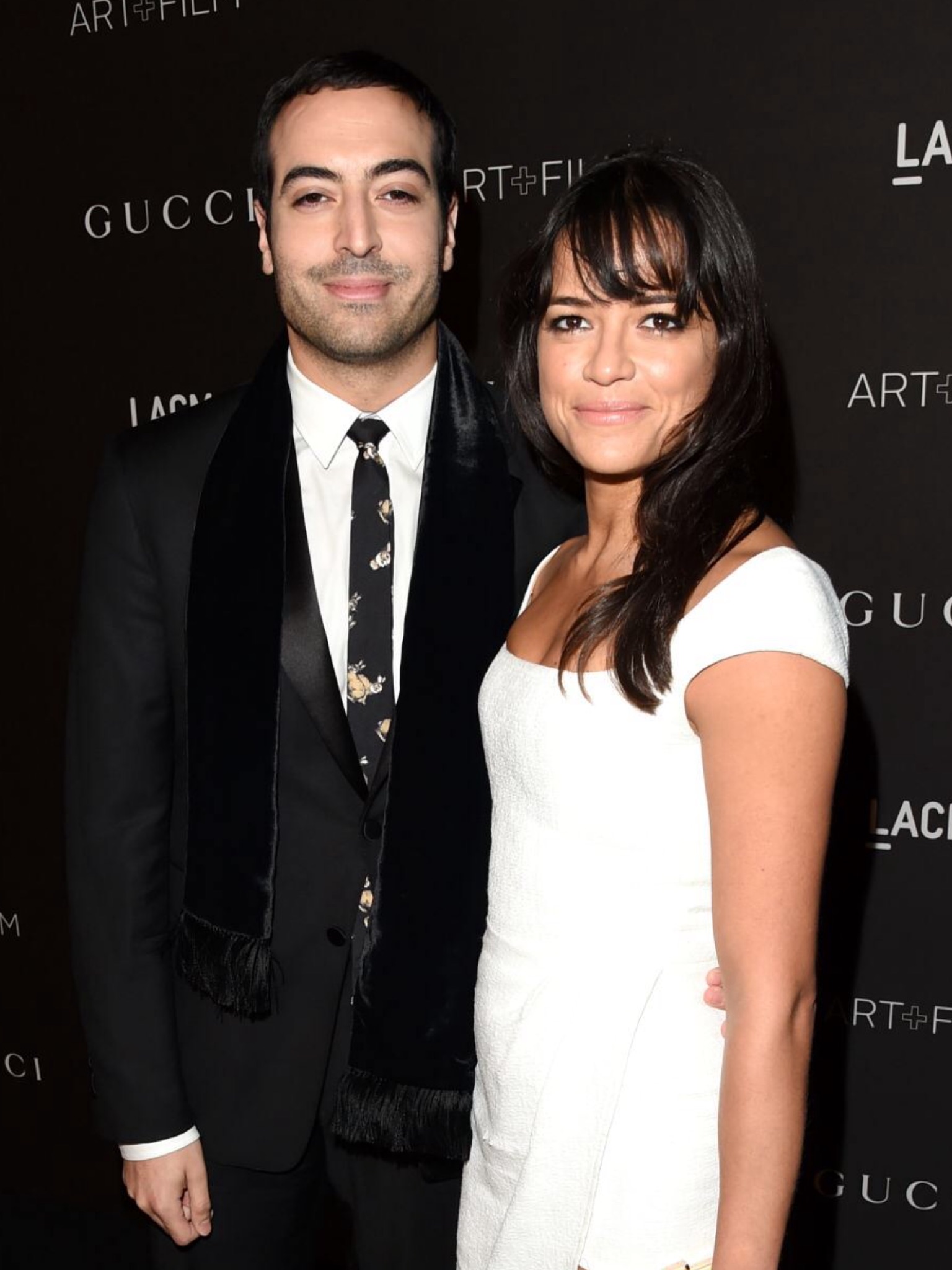 Producer Mohammed Al Turki and actress Michelle Rodriguez attend the 2014 LACMA Art + Film Gala honoring Barbara Kruger and Quentin Tarantino presented by Gucci at LACMA on November 1, 2014 in Los Angeles, California. CREDIT: JASON MERRITT