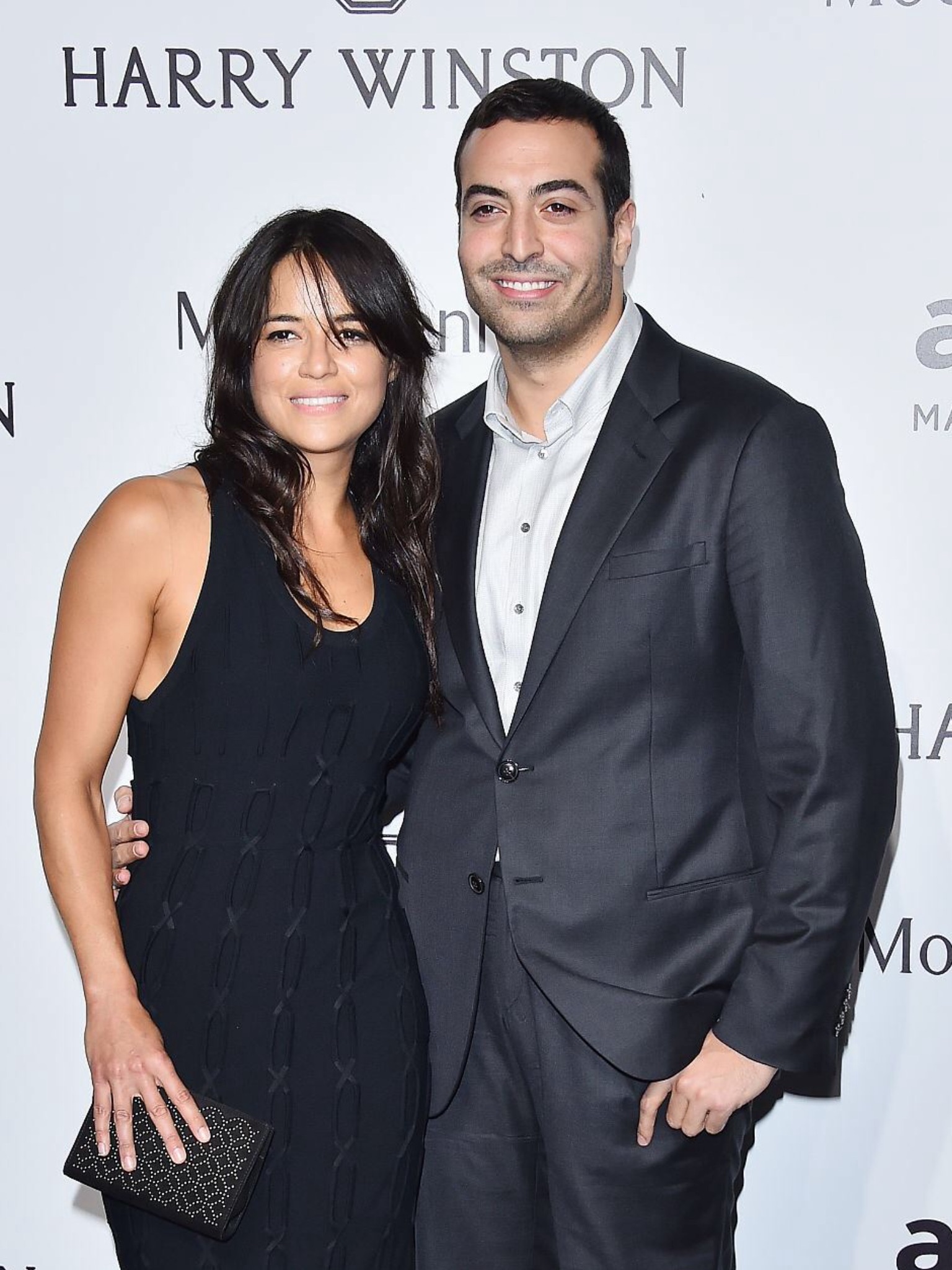 Michelle Rodriguez and Mohammed Al Turki arrive at amfAR Milano 2015 at La Permanente on September 26, 2015 in Milan, Italy.