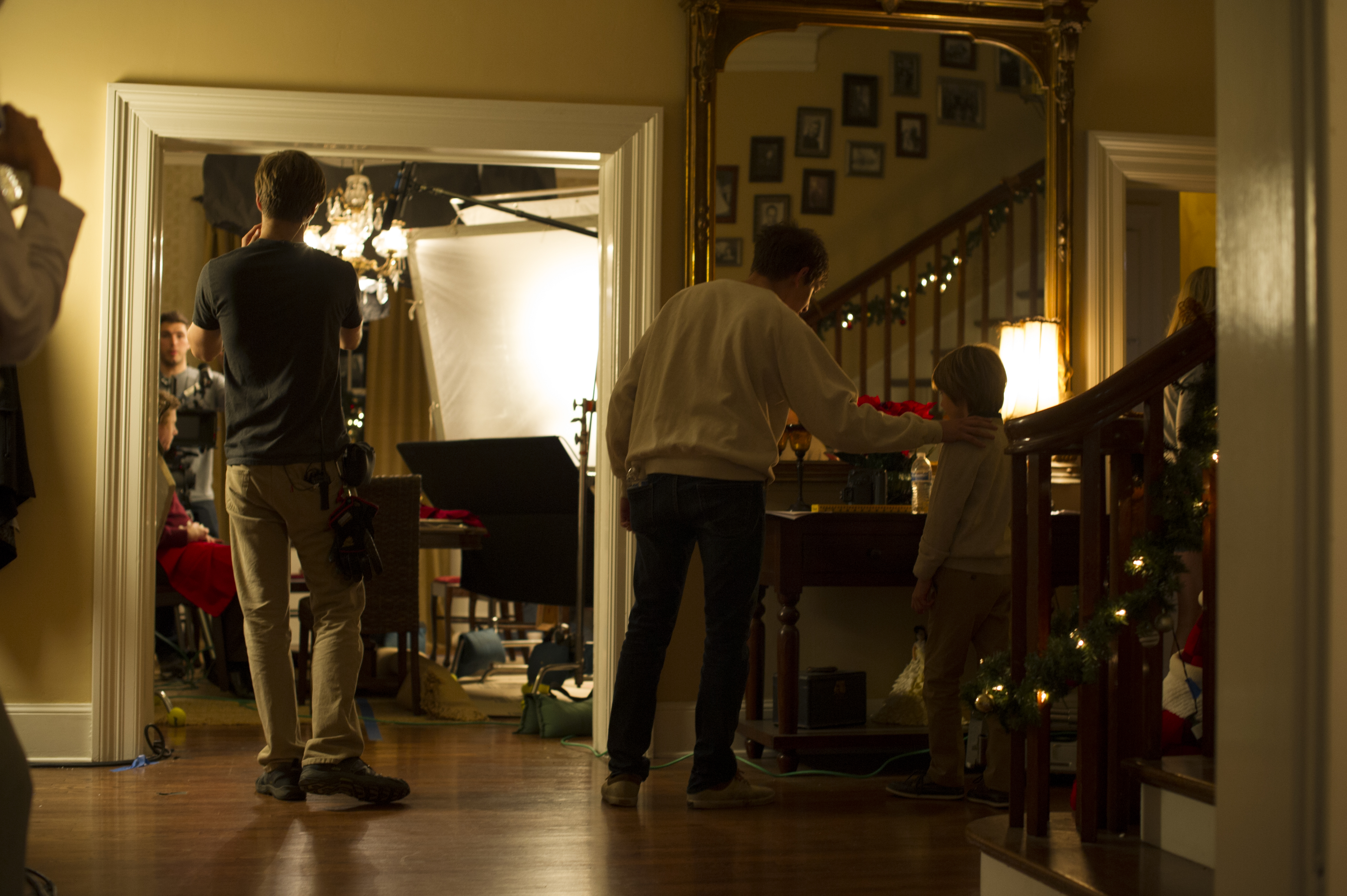 Director Brandon Kapelow prepares for a take with Oliver Bell on the set of Blessed, Our Father