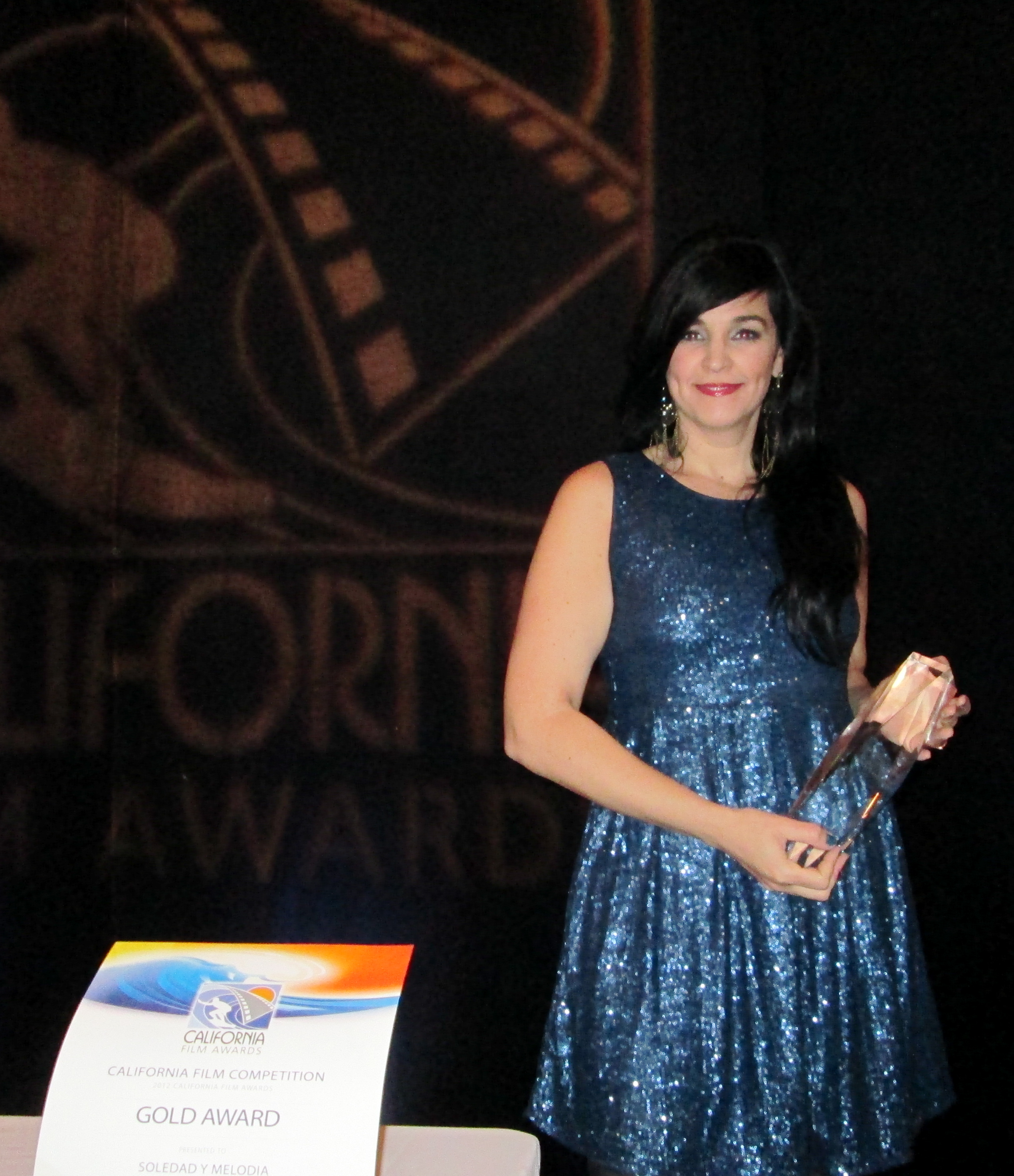 Lead actress, Ivone Reyes posing with the Gold award received for Best Short at The California Film Awards, January 26, 2013.
