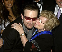 ZARAH behind Bono with Dr. Ruth at the Musicares event.