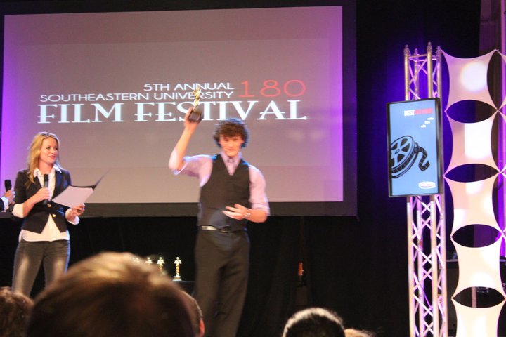 Logan Accepting the award for Best Cinematography at the 2011 180 Film Festival