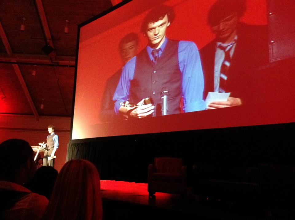 Logan accepting the award for Best Cinematography at the 2012 180 Film Festival.
