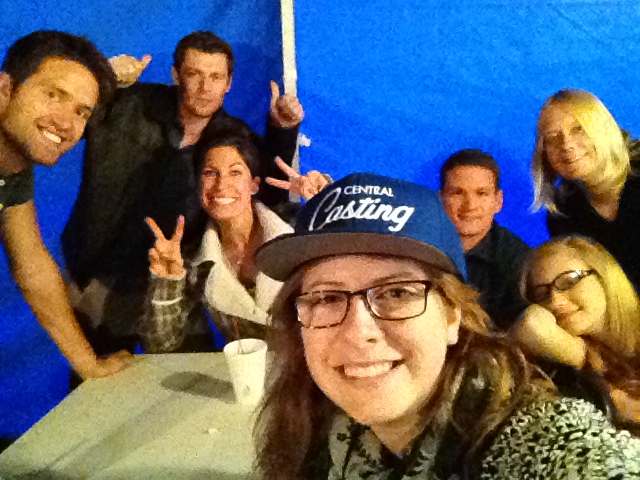 Carly on the set with the Background Actors she cast in a show.