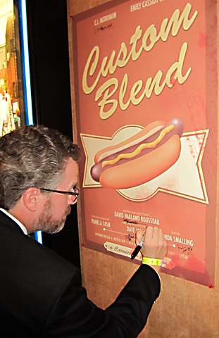 Signing the poster for the movie, Custom Blend, at the 2014 Knoxville Film Festival.