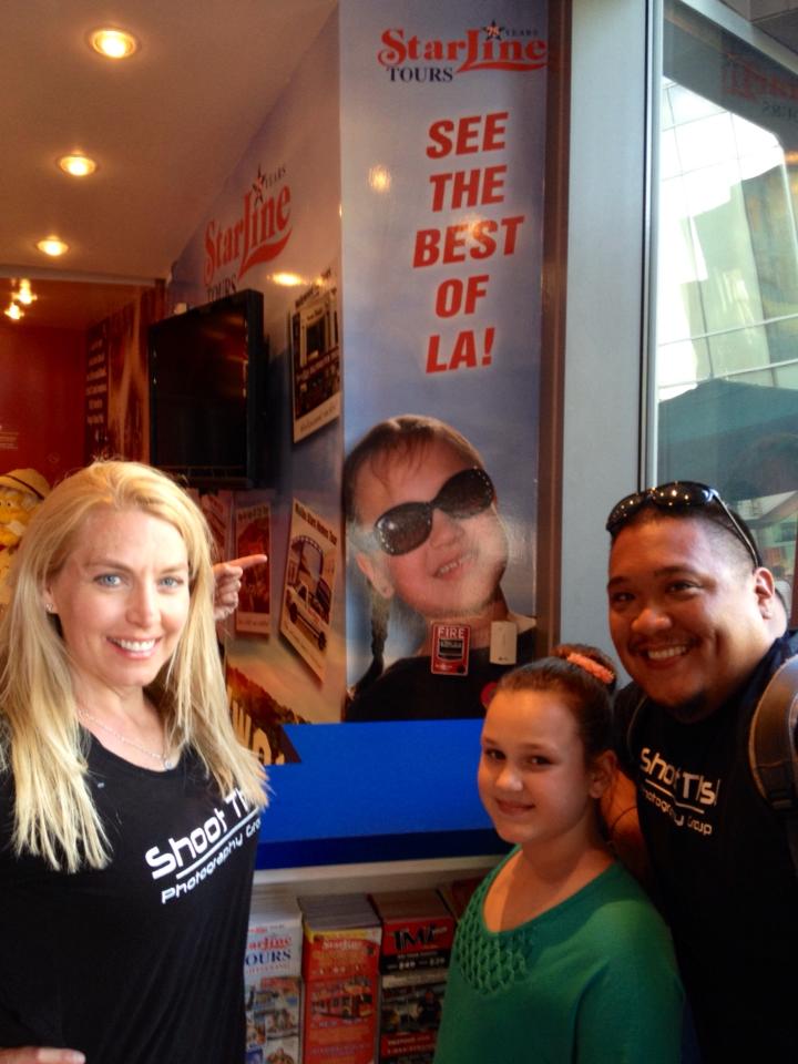 Carly with her manager and the photographer who took the photo on the back wall for Starline Tours of Hollywood ads.