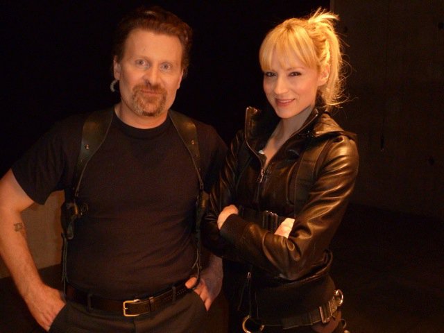 Todd A. Robinson and Beth Riesgraf on the set of a promo for TNT's Leverage (2008)