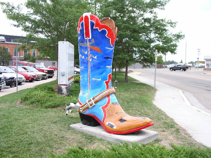 Public art installation, Cheyenne Wyoming airport, 2004. Around town, various boots celebrated the railroad, ranching, nature. Mine has the history of the airport, with examples of every important aircraft type to fly in and out of Cheyenne. The boot is n