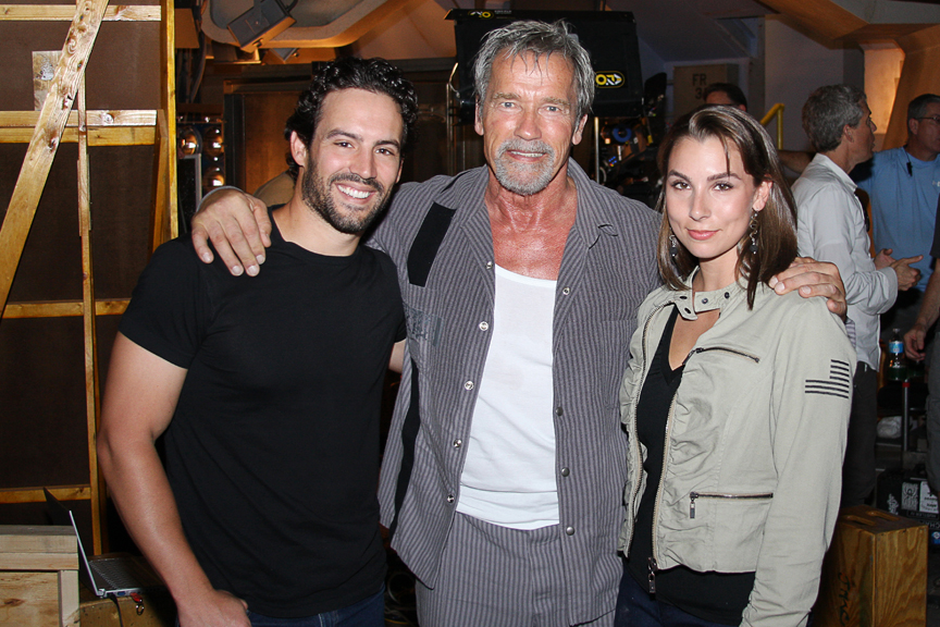 (L-R) Robert Nuzzie, Arnold Schwarzenegger, Aubree Marchione on set.