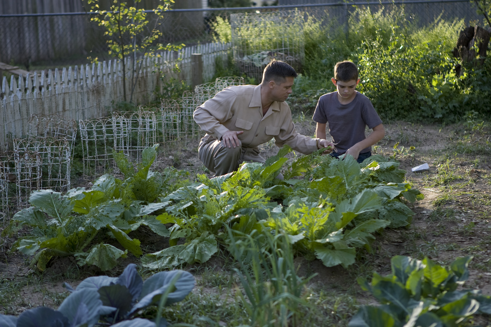 Still of Brad Pitt and Hunter McCracken in The Tree of Life (2011)