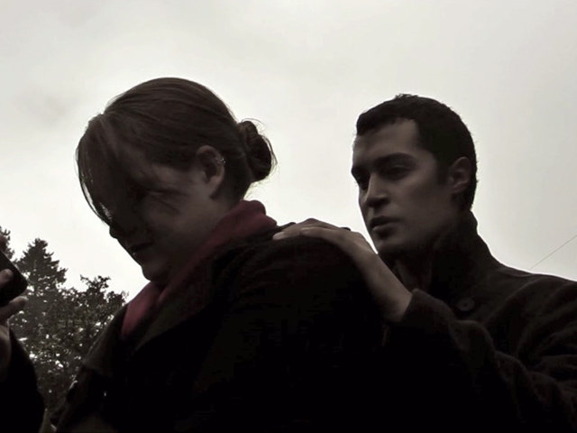 Dan (Matthew Salinas) holds Jenny (Brittany Warner) at gunpoint, demanding that she hands over her purse.