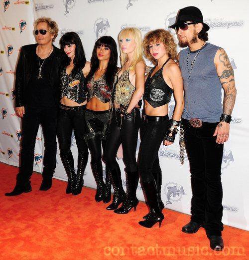 MIAMI, FL - Musicians Matt Sorum and Dave Navarro with musical group Darling Stilettos walk Miami Dolphin's Orange Carpet.