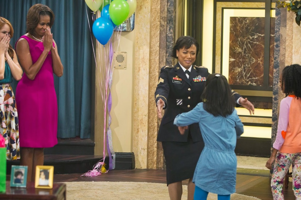 Yvette Saunders as Sergeant Harris, with Michelle Obama on Disney's 