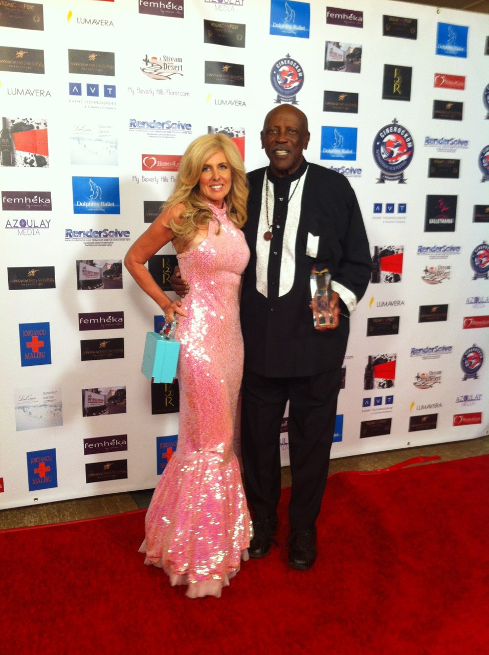 Cynthia Martin with Academy Award, Golden Globe and Emmy winning actor, Lou Gossett, Jr. receiving a 