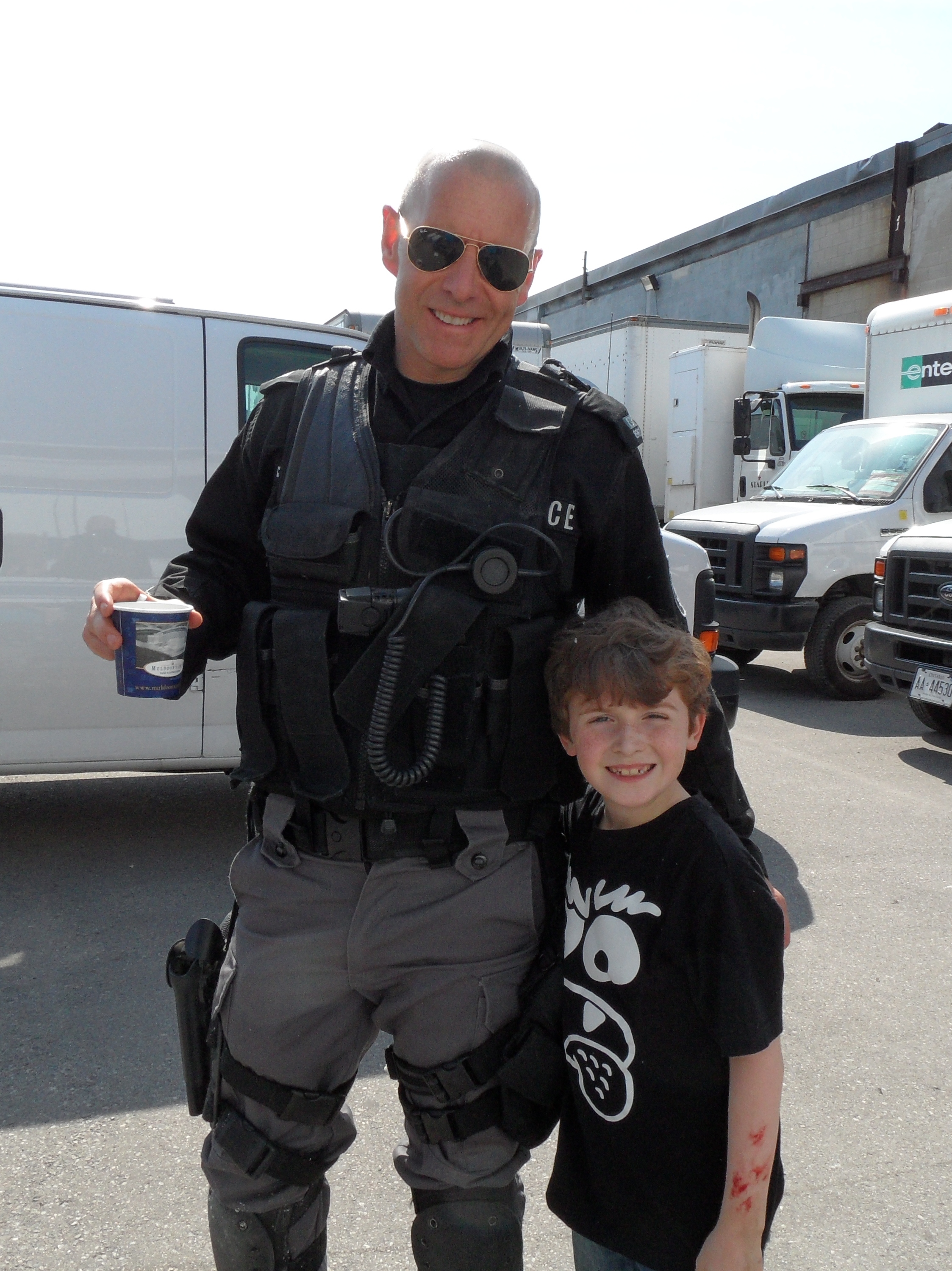 Flashpoint (T.V. series) - on set proudly sporting fake blood on his arm with Hugh Dillon June 2012.