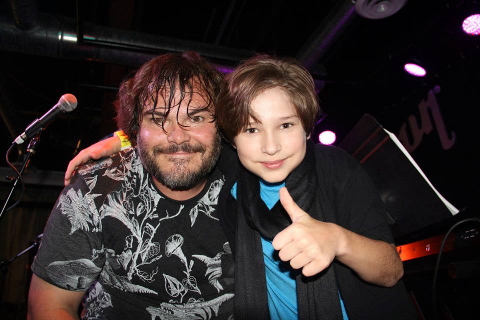 Young Actor and Musician Blaze Tucker meets Inspiring Actor and Musician Jack Black on stage.