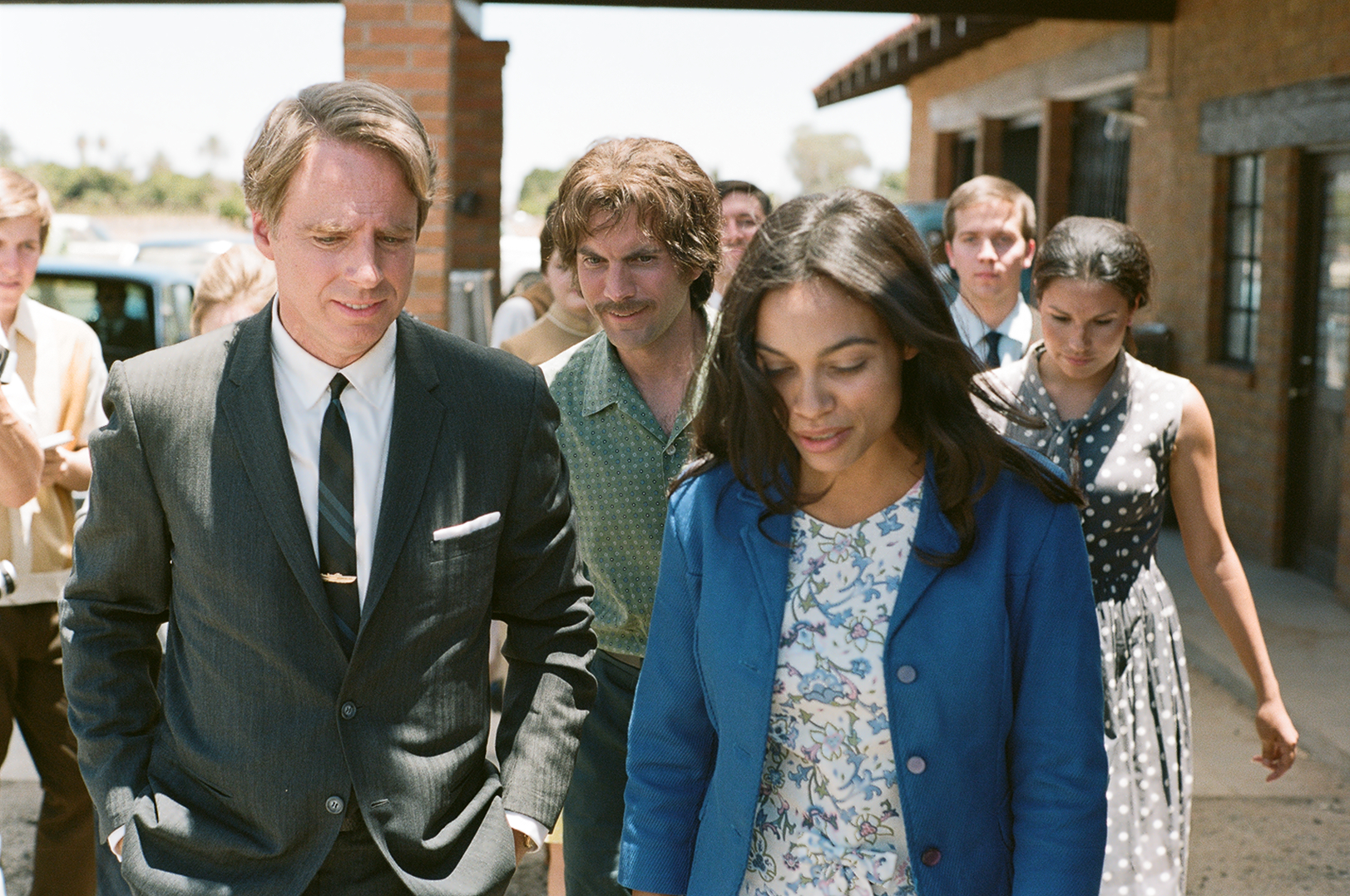 RFK in CHAVEZ: Jack Holmes as Sen. Robert F. Kennedy walks with Rosario Dawson as Dolores Huerta, Wes Bentley as Jerry Cohen walks behind, in 