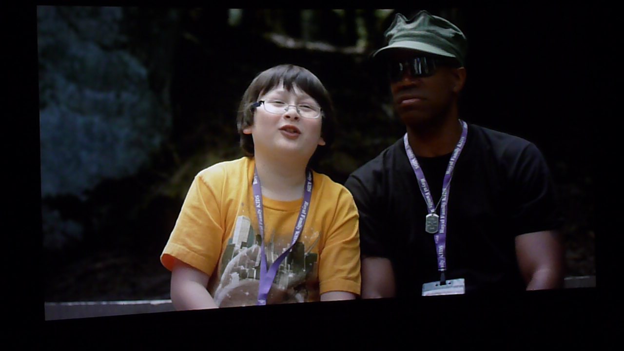 Still shot, from the feature film CAMP, shows Matthew Jacob Wayne as 'Redford', with Asante Jones as 'Counselor Samuel'.