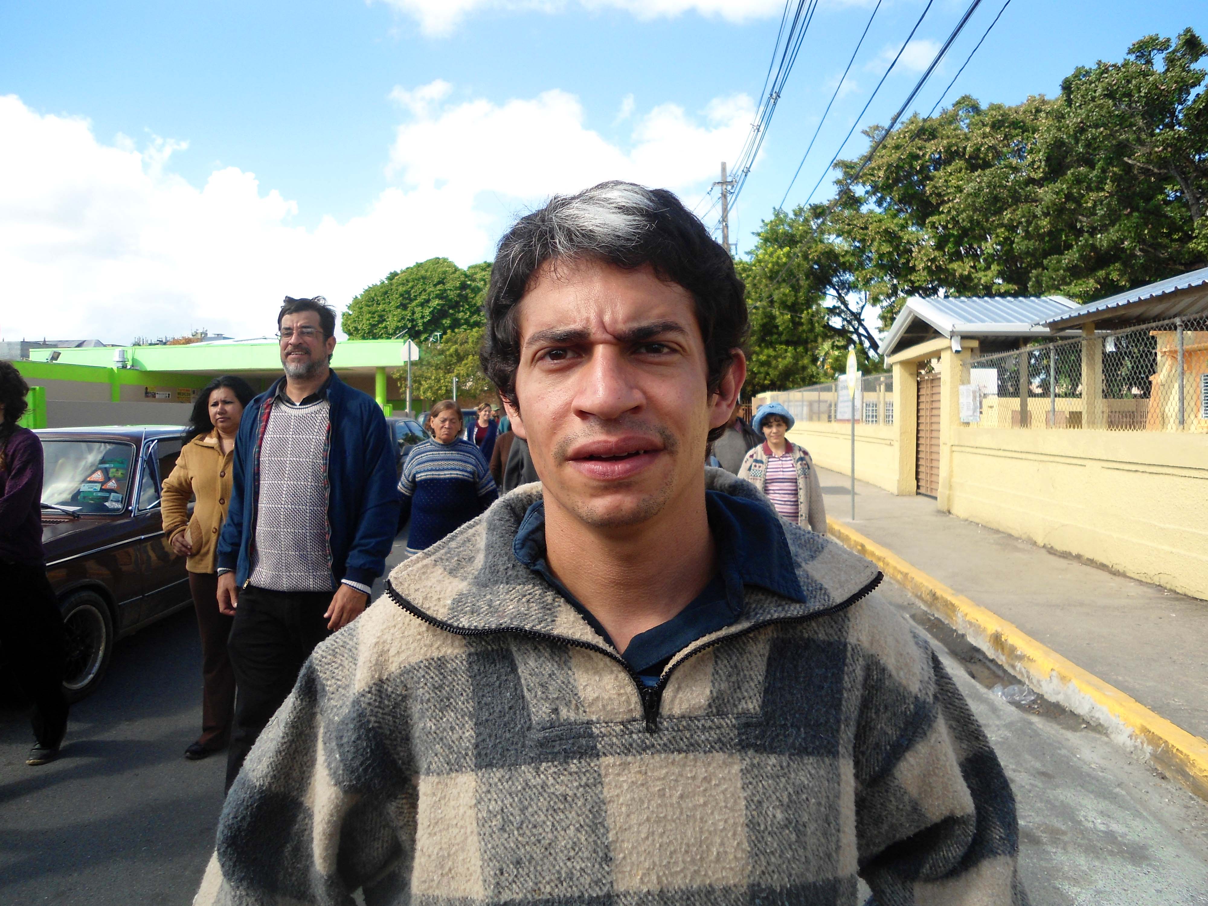A Bolivian student marches towards a protest, in the film, Our Brand Is Our Crisis.