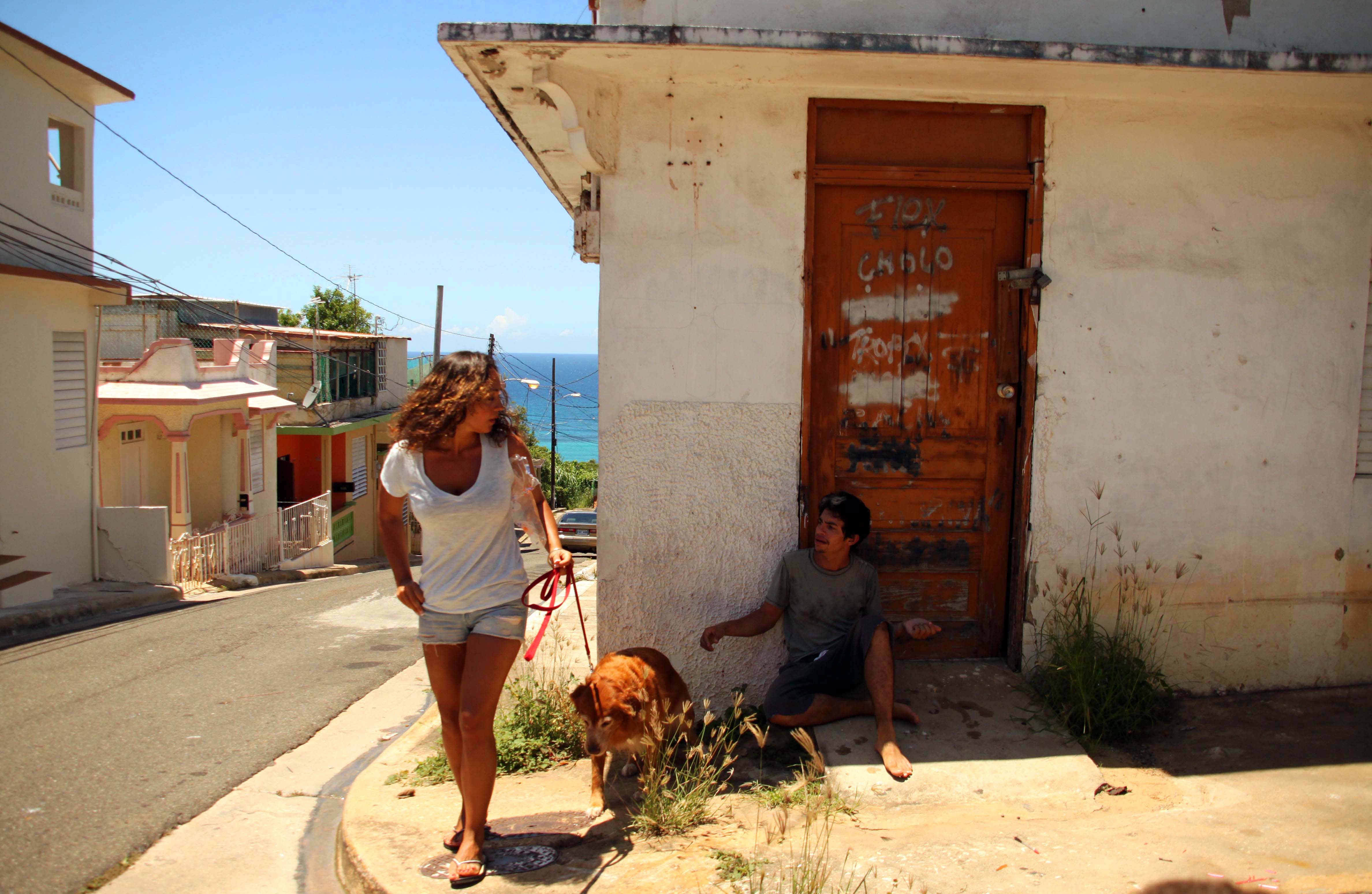 As the bum delivers Linda, the dog, Gabi gives me a couple of dollars as a tip. Still shot from the short film, Gabi.