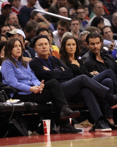 Actor Billy Crystal and producer Mark Stewart attend the game between the Los Angeles Clippers and the Minnesota Timberwolves at Staples Center on April 10, 2013 in Los Angeles, California.