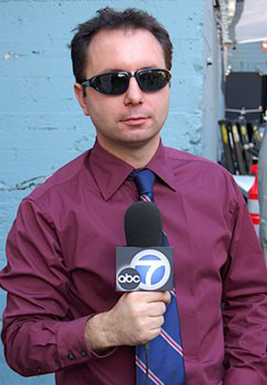 Michael G Welch acting as a reporter.