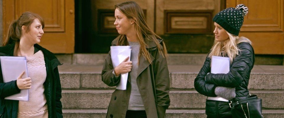 Tanya departs from the other two religious volunteers on steps of church.