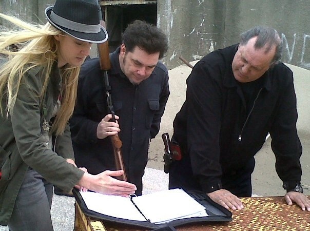First Assitant Director Iabou WIndimere, Director Randy Fabert, and Acotr Doug Palmer, discussing the script on the set of 