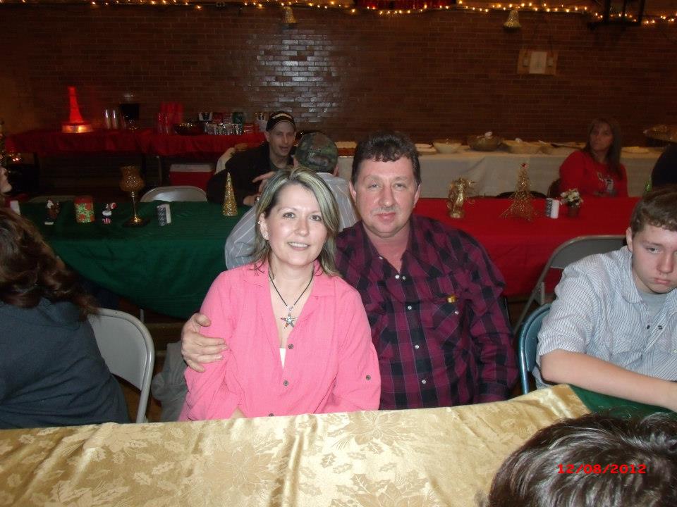 Her and her husband, David, at a Christmas banquet.