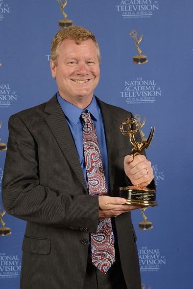 John Horrigan with a 2014 Boston/New England Emmy Award for 