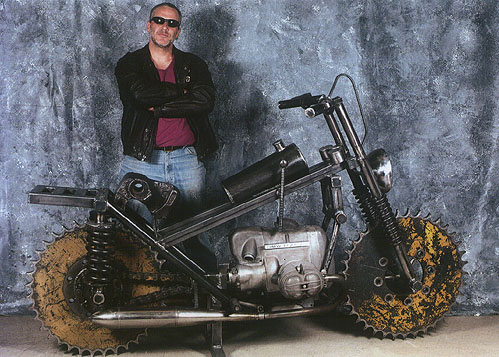 Sculptor Bruce Gray with his Motorcycle sculpture made from train parts and a BMW motorcycle engine.