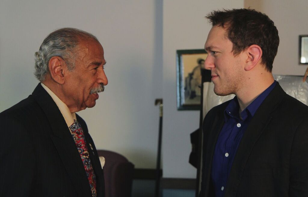 Jesse Nesser and Congressman John Conyers Jr talk following an interview for 