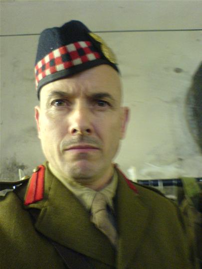 James Hicks as Captain in Coward