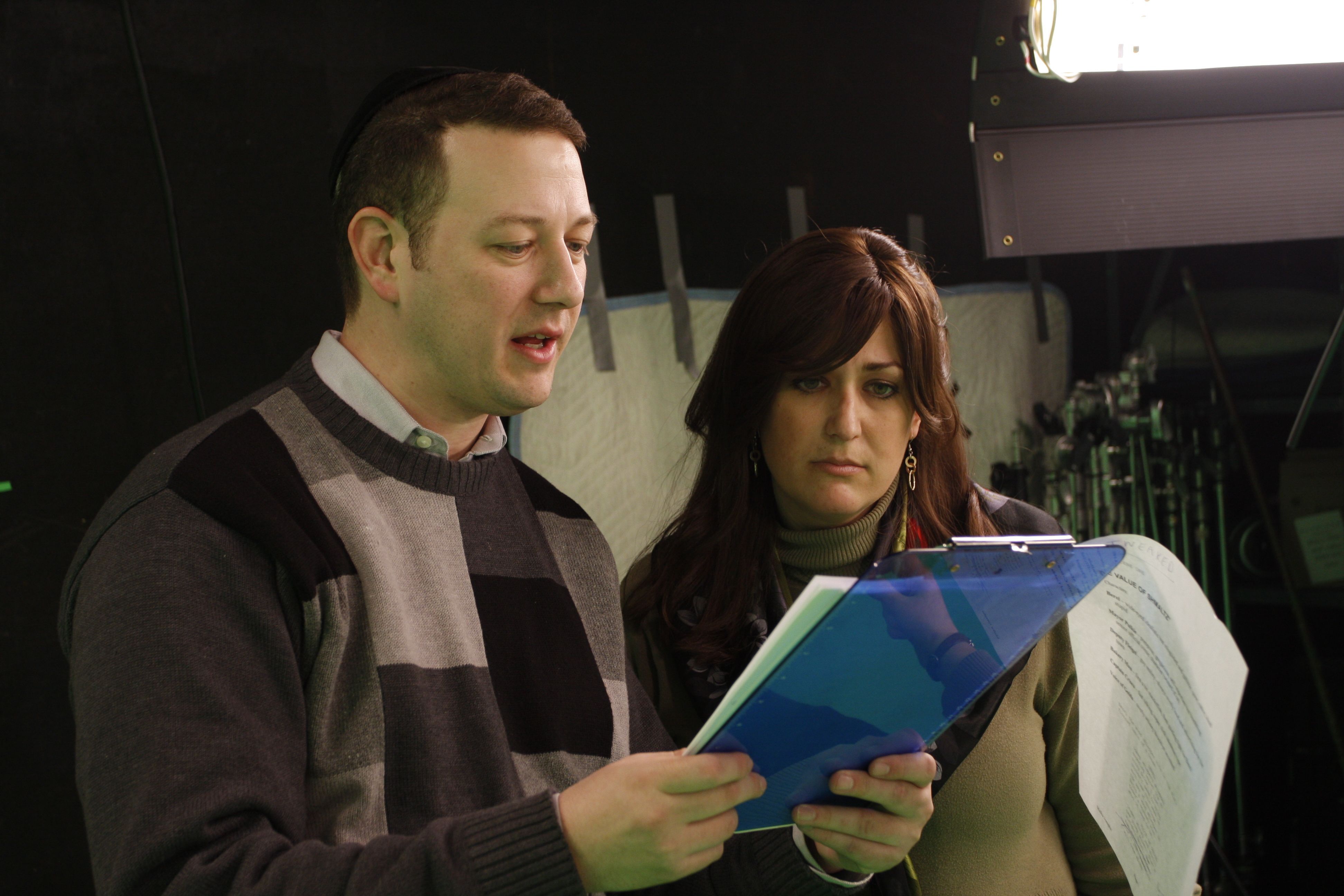 Reviewing screenplay at the set with writer Malka Leah Josephs
